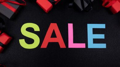 Vibrant SALE text surrounded by gift boxes offers perfect promotional imagery.