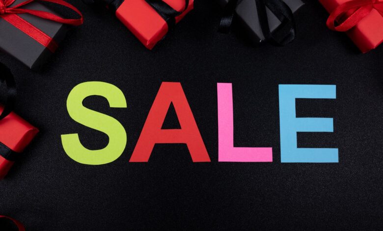 Vibrant SALE text surrounded by gift boxes offers perfect promotional imagery.