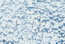 Abstract digital illustration of scattered white geometric blocks creating a textured background.