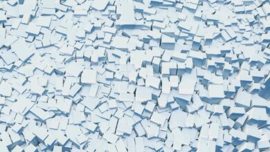 Abstract digital illustration of scattered white geometric blocks creating a textured background.