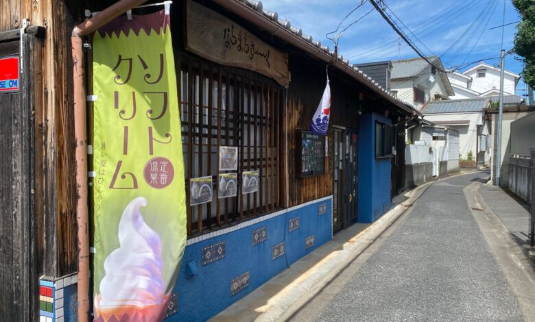 Charming wooden shop on a quiet Japanese street, showcasing traditional architecture.