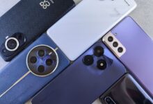Top view of various modern smartphones showcasing diverse camera designs on flat surface.