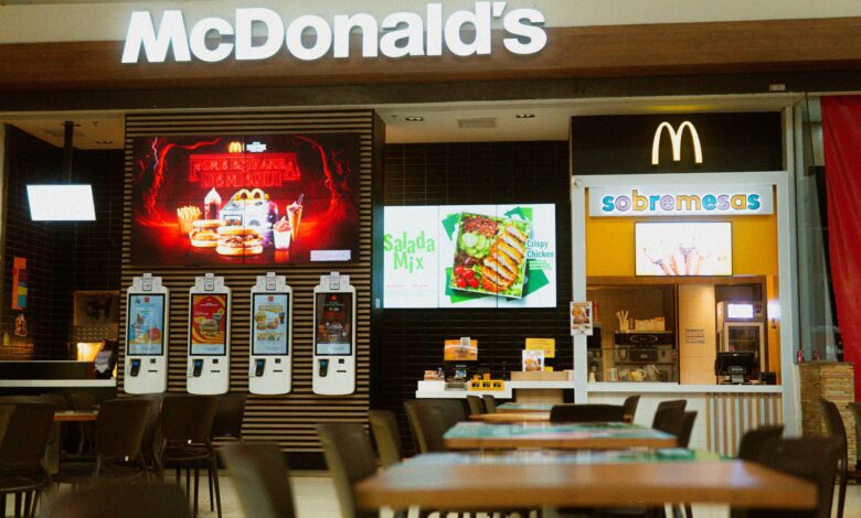 McDonald's fast food restaurant featuring self-service kiosks and digital menus.