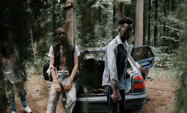 Chilling scene of zombies near an abandoned car in a dense forest.