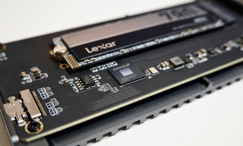 Detailed view of a Lexar NVMe SSD mounted on a circuit board, highlighting electronic components.