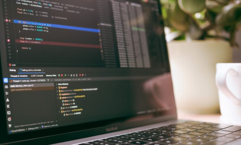 A laptop screen showing programming code and debugging tools, ideal for tech topics.