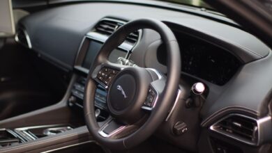Stylish interior of a luxury car featuring a sleek dashboard and modern controls for a premium driving experience.