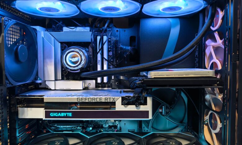 Close-up of an advanced gaming desktop PC with GeForce RTX, liquid cooling, and RGB lighting.
