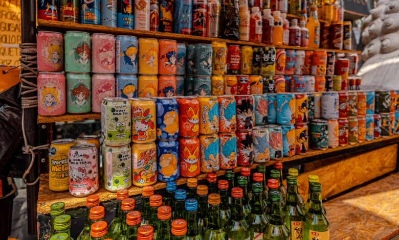 Vibrant display of Korean drinks and sodas at a bustling market in Mexico City.