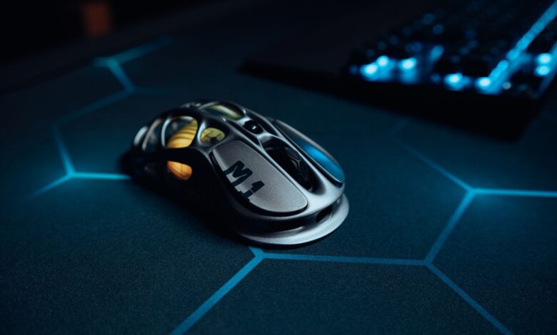 High-tech gaming mouse on illuminated hexagonal pattern mousepad, perfect for gamers.