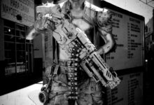A black and white image of a cyberpunk soldier character in Tijuana, Mexico, holding a futuristic weapon.