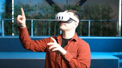 A man wearing a VR headset interacts with augmented reality indoors.