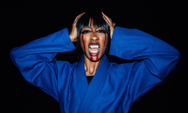 Creative Halloween portrait of a woman in a karate uniform with vampire makeup.