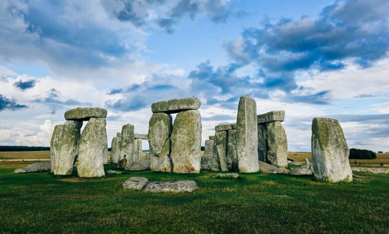 Scenic view of Stonehenge with a dramatic sky in England, showcasing ancient megalithic stones.