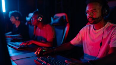 Young men engrossed in a competitive eSports gaming session, displaying teamwork and focus.