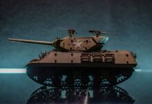 A detailed model of a military tank on a reflective surface with a dramatic background.