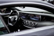 Explore the elegant interior of a Mercedes-Benz with intricate details and a sleek design.