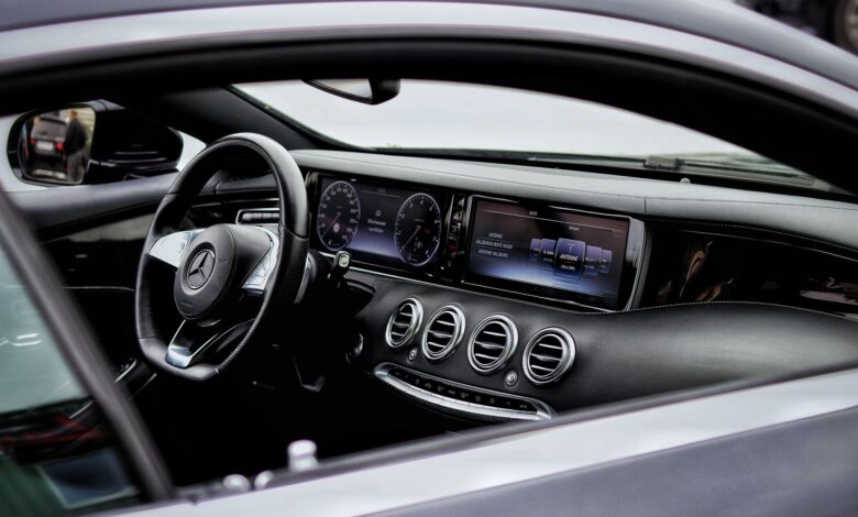 Explore the elegant interior of a Mercedes-Benz with intricate details and a sleek design.