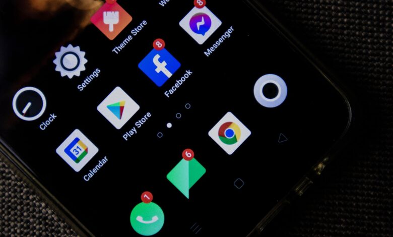Close-up of a smartphone screen displaying various social media and app icons.