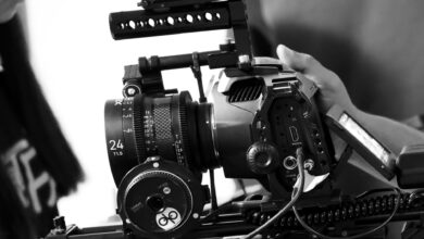 Detailed view of a professional movie camera rig in black and white, showcasing filmmaking equipment.