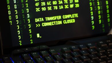 Data transfer complete message displayed on a computer monitor with a keyboard underneath.