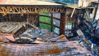 A dramatic view of a collapsed building roof showcasing architectural decay in Banten, Indonesia.