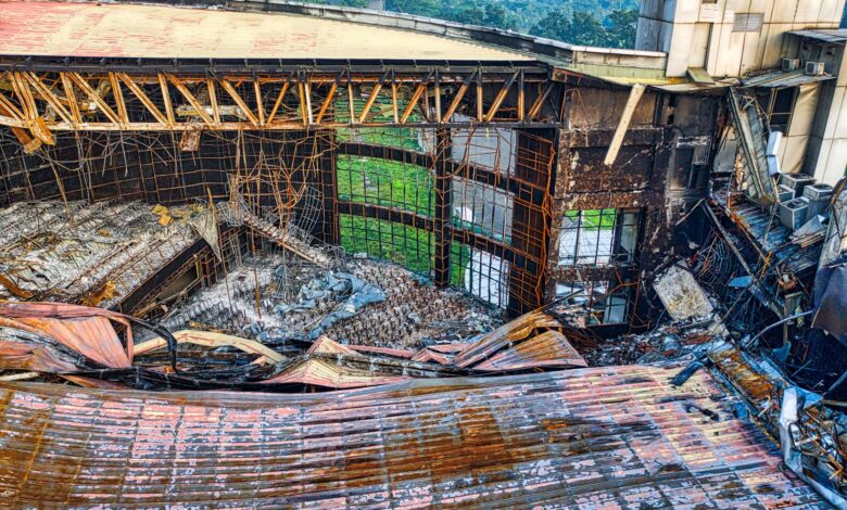 A dramatic view of a collapsed building roof showcasing architectural decay in Banten, Indonesia.