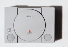 Close-up of a classic Sony PlayStation console on a white background