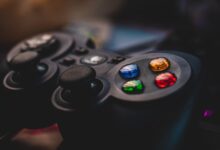 Detailed shot of a gaming controller featuring colorful control buttons and joysticks.