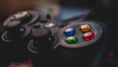 Detailed shot of a gaming controller featuring colorful control buttons and joysticks.