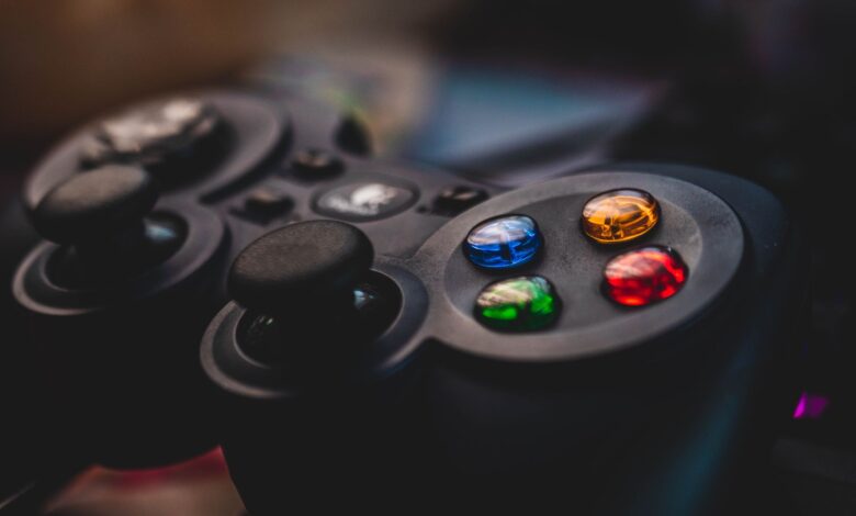 Detailed shot of a gaming controller featuring colorful control buttons and joysticks.