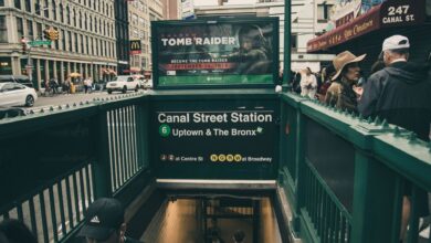 Canal Street Station entrance with urban street scene in New York City.