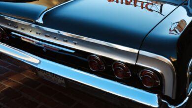 A classic Chevrolet car with mirror-like reflections captures the vintage essence against Seattle's urban backdrop.