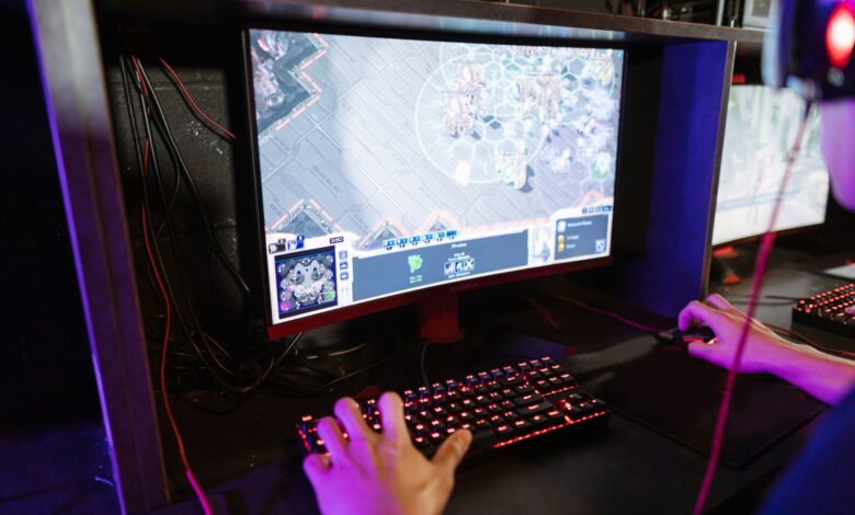 Engaging in an online gaming session with a modern setup, highlighting technology and recreation.