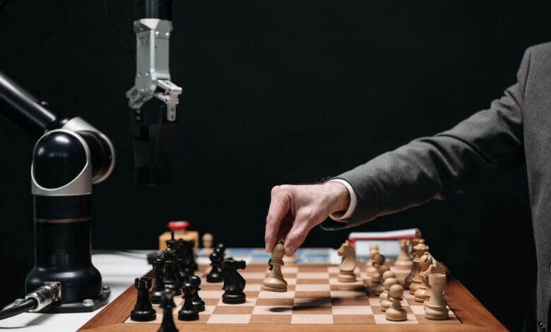 A robotic arm plays chess against a human, symbolizing AI innovation and strategy.