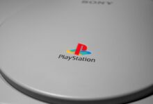 Detailed close-up of iconic PlayStation console logo, perfect for gaming-related content.