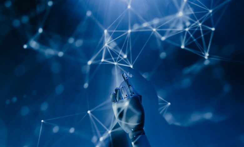 A robotic hand reaching into a digital network on a blue background, symbolizing AI technology.