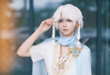 Stunning portrait of an adult in fantasy-themed cosplay with white hair and decorative jewelry.