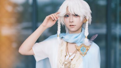 Stunning portrait of an adult in fantasy-themed cosplay with white hair and decorative jewelry.
