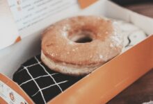 Delicious glazed donut in a box, perfect for sweet indulgence. Photographed in Bandung.