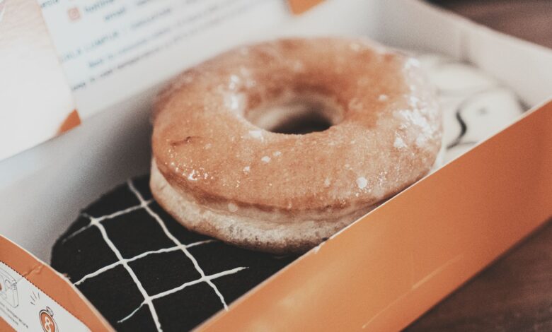Delicious glazed donut in a box, perfect for sweet indulgence. Photographed in Bandung.