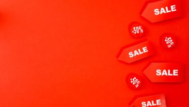 Red sale tags with 50% discounts on vibrant background for retail promotions.