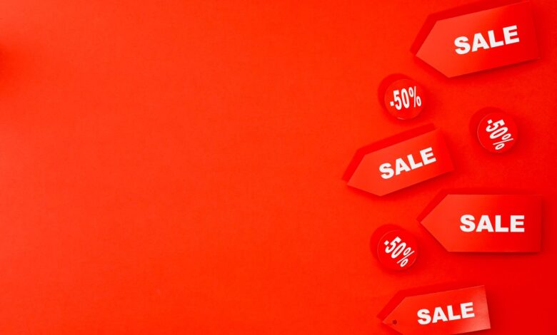 Red sale tags with 50% discounts on vibrant background for retail promotions.