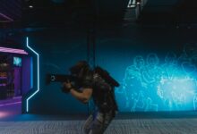 A man fully engaged in an immersive virtual reality gaming experience indoors.