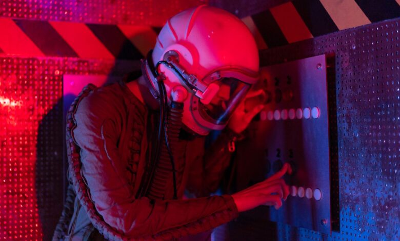 Female astronaut interacts with a control panel in a futuristic spaceship setting.