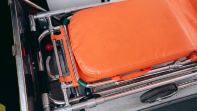 Close-up view of an orange stretcher inside an ambulance, emphasizing medical equipment.