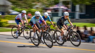 Fast-paced bicycle race with four cyclists competing on a sunny day.