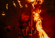 An electrifying image of a fire performer showcasing incredible skills at an Orlando theme park at night.