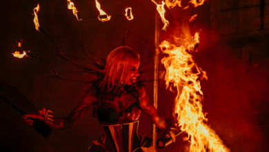 An electrifying image of a fire performer showcasing incredible skills at an Orlando theme park at night.