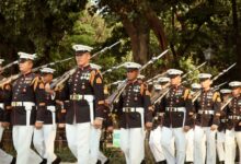 A group of soldiers in formal uniforms marching in a military parade in Manila, Philippines.
